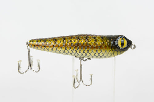 Bloodshot Raptor - Handmade Japanese Pencil Bait - Snake Skin pattern, new in original packaging, side view of fishing lure. 