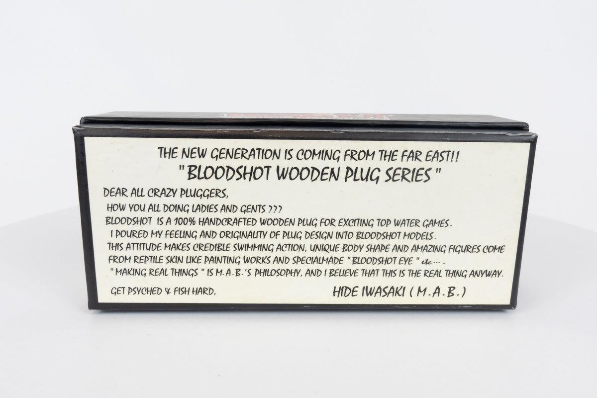 Bloodshot Raptor - Handmade Japanese Pencil Bait - Snake Skin pattern, new in original packaging, rear view of packaging box. 