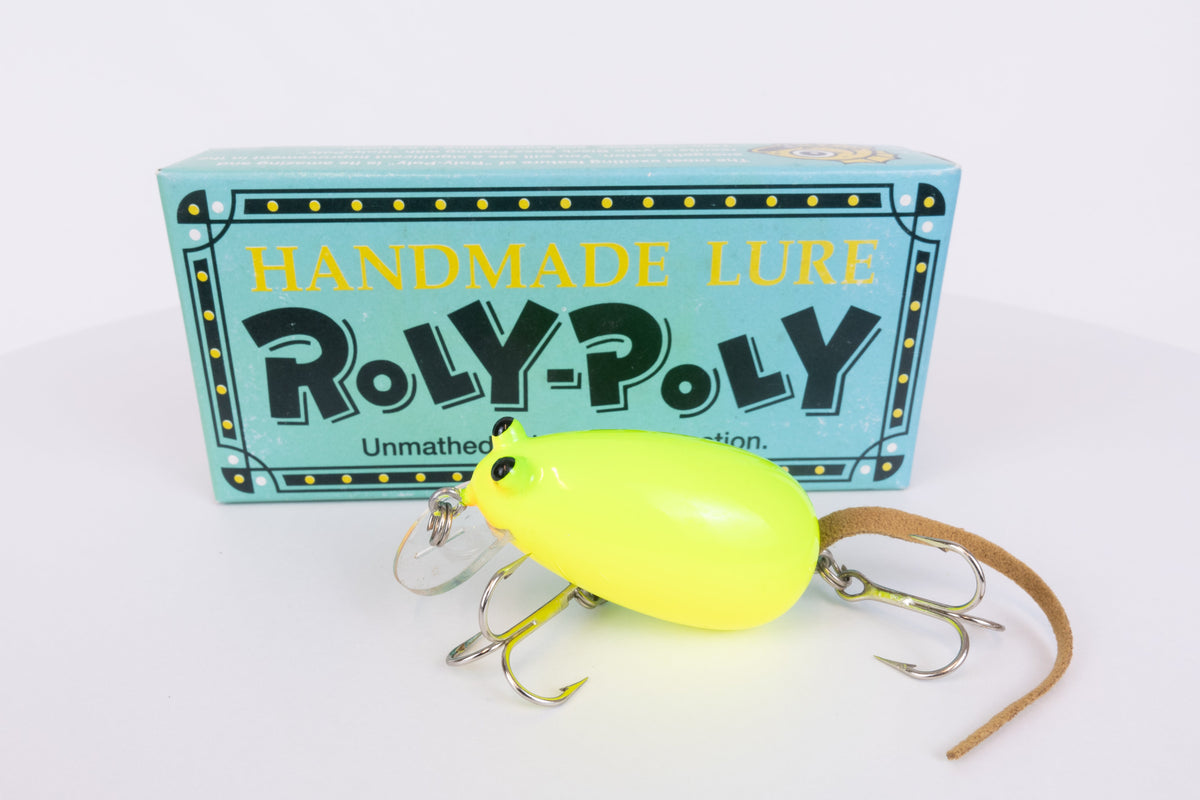 Roly-Poly - Handmade Japanese surface crankbait - Chartreuse colour, side view of fishing lure with box in background