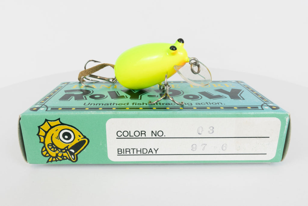 Roly-Poly - Handmade Japanese surface crankbait - Chartreuse colour, side view of fishing lure on original box