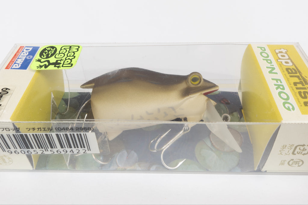 Daiwa Bass Pop'n Frog - Tsuchigaeru, discontinued Japanese fishing lure, new in original packaging, close up view. 