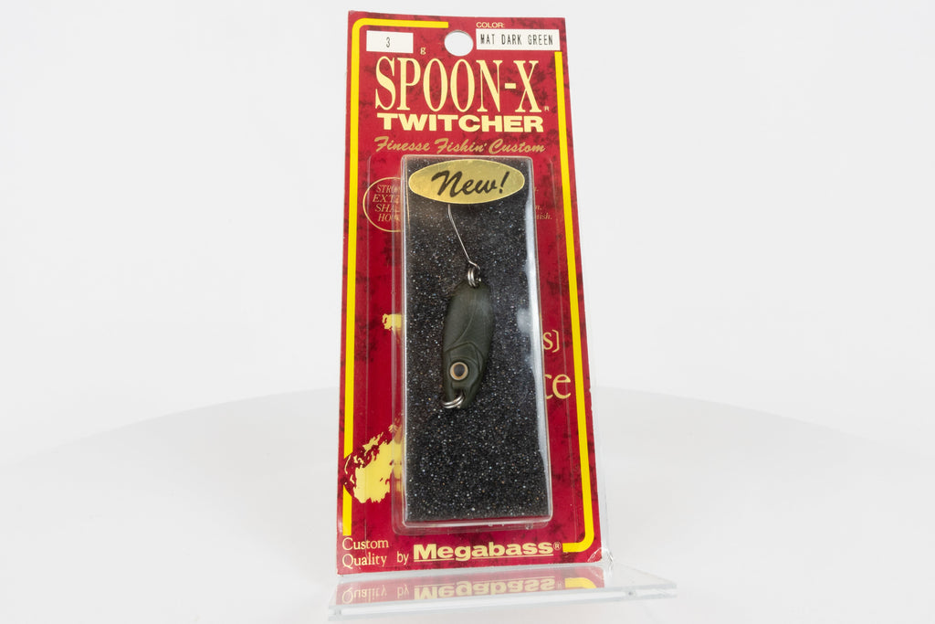 Megabass Spoon-X Twitcher - Mat Dark Green, discontinued Japanese made lure, new in original packaging, front view.