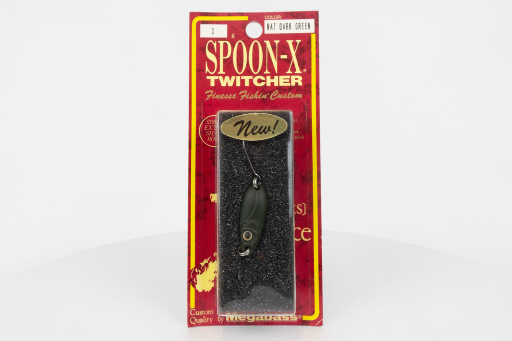 Megabass Spoon-X Twitcher - Mat Dark Green, discontinued Japanese made lure, new in original packaging, front view.