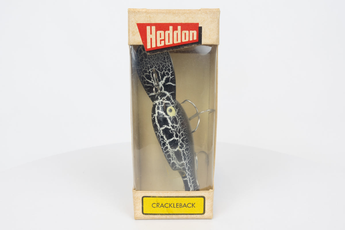 Heddon Crackleback 8000 WBC - White Black Crackle - vintage fishing lure from the USA in original packaging. View of lure in box