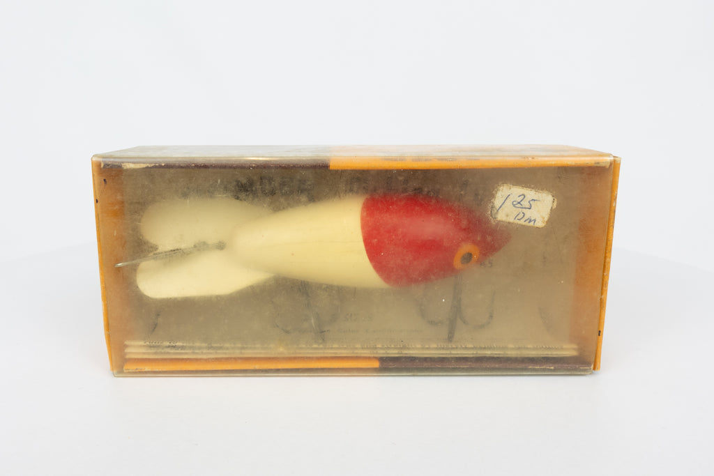 Bomber Bait Co. Bomber - vintage American fishing lure, near new condition in original packaging (aged), side view of lure box.
