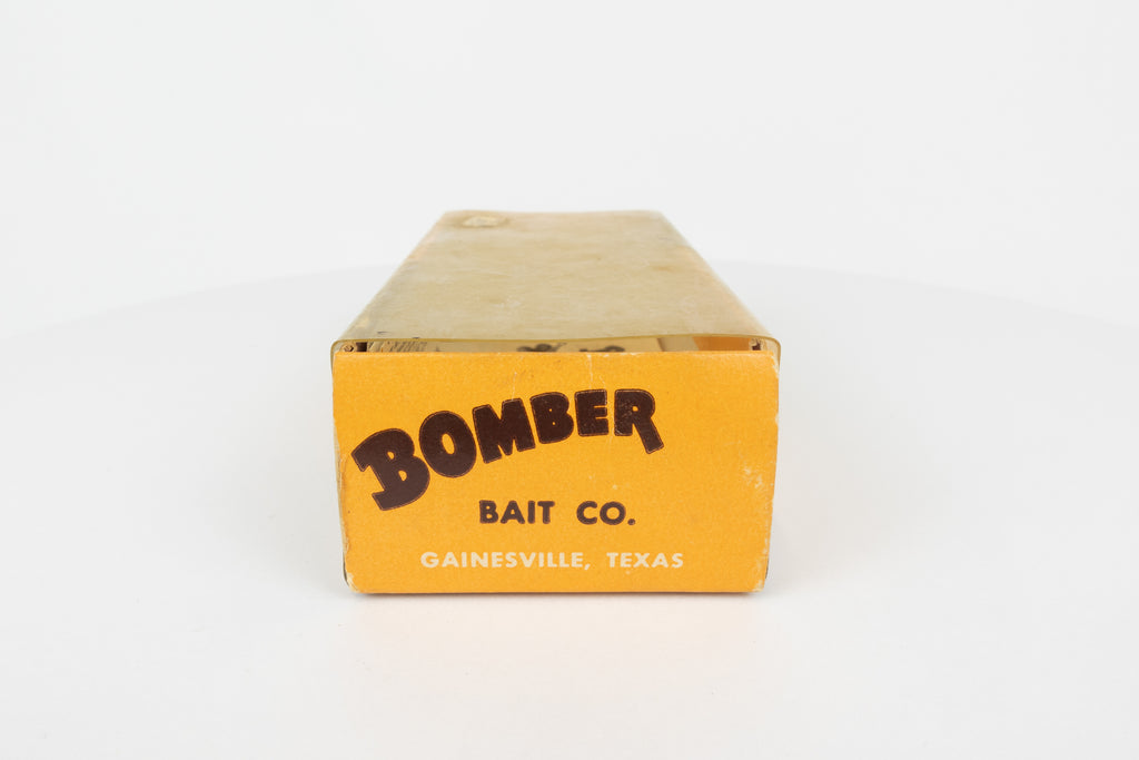 Bomber Bait Co. Bomber - vintage American fishing lure, near new condition in original packaging (aged), end view of lure box.