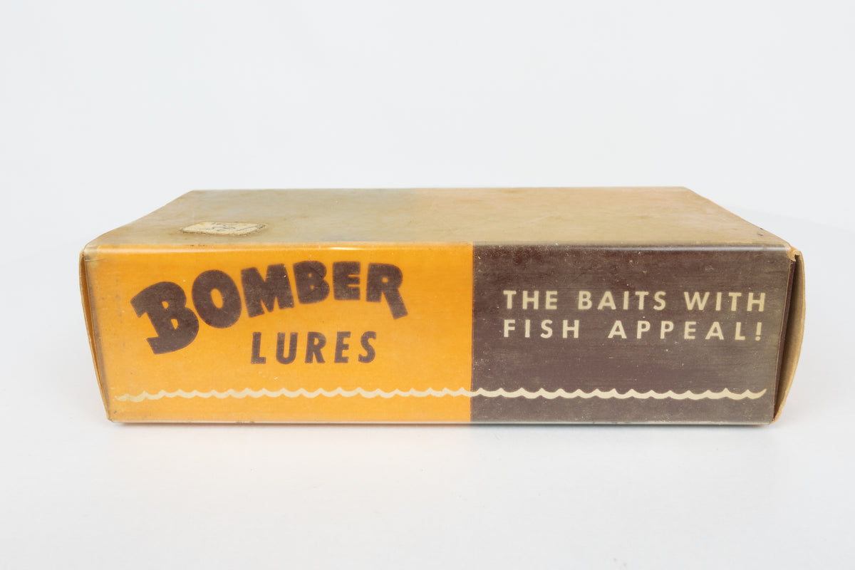 Bomber Bait Co. Bomber - vintage American fishing lure, near new condition in original packaging (aged), side view of lure box.