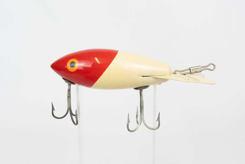 Bomber Bait Co. Bomber - vintage American fishing lure, near new condition in original packaging (aged), left side view of lure.