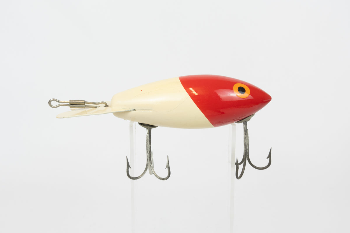Bomber Bait Co. Bomber - vintage American fishing lure, near new condition in original packaging (aged), right side view of lure.
