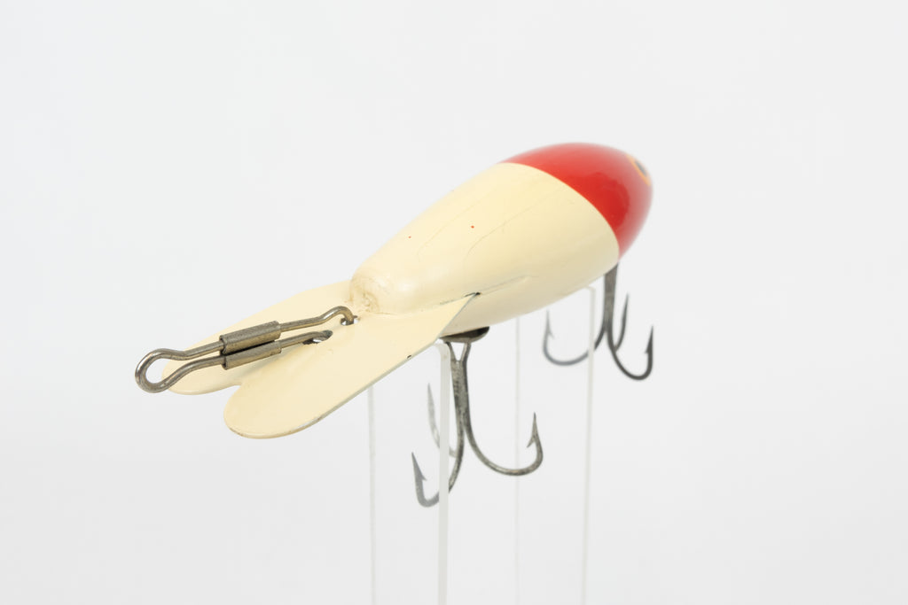 Bomber Bait Co. Bomber - vintage American fishing lure, near new condition in original packaging (aged), rear view of lure.