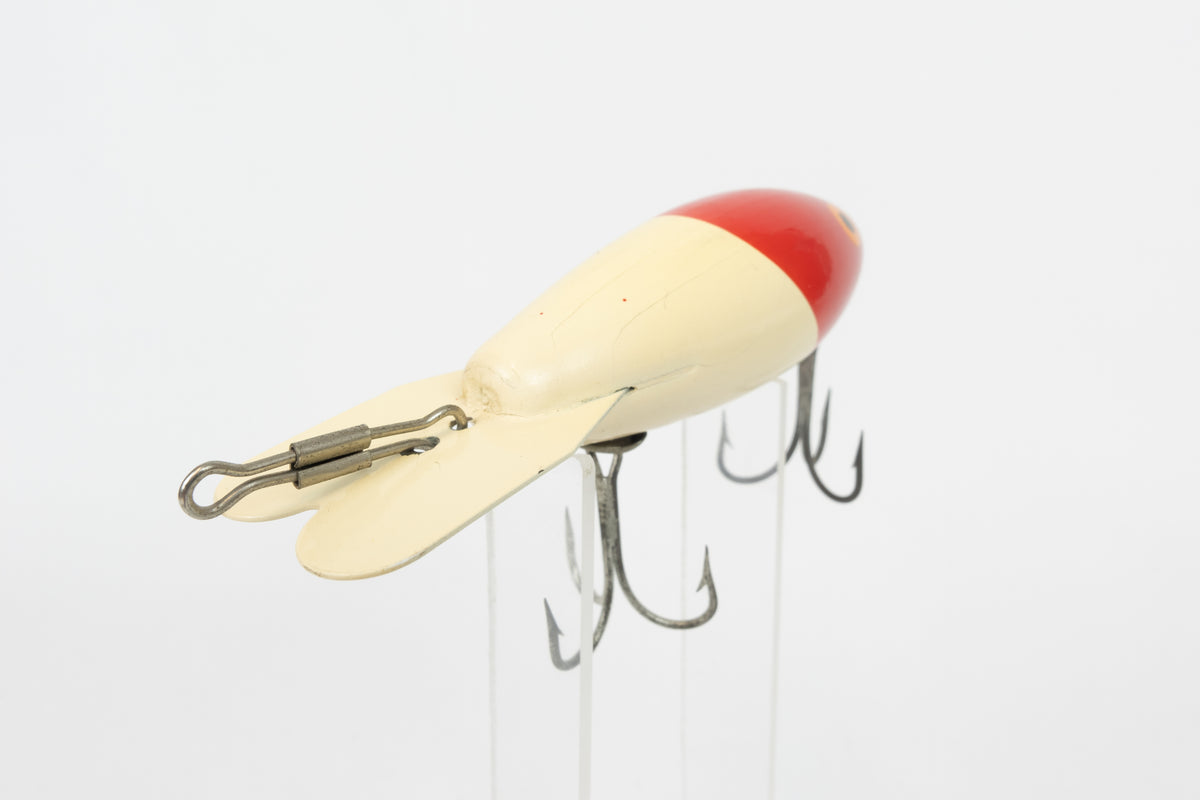 Bomber Bait Co. Bomber - vintage American fishing lure, near new condition in original packaging (aged), rear view of lure.