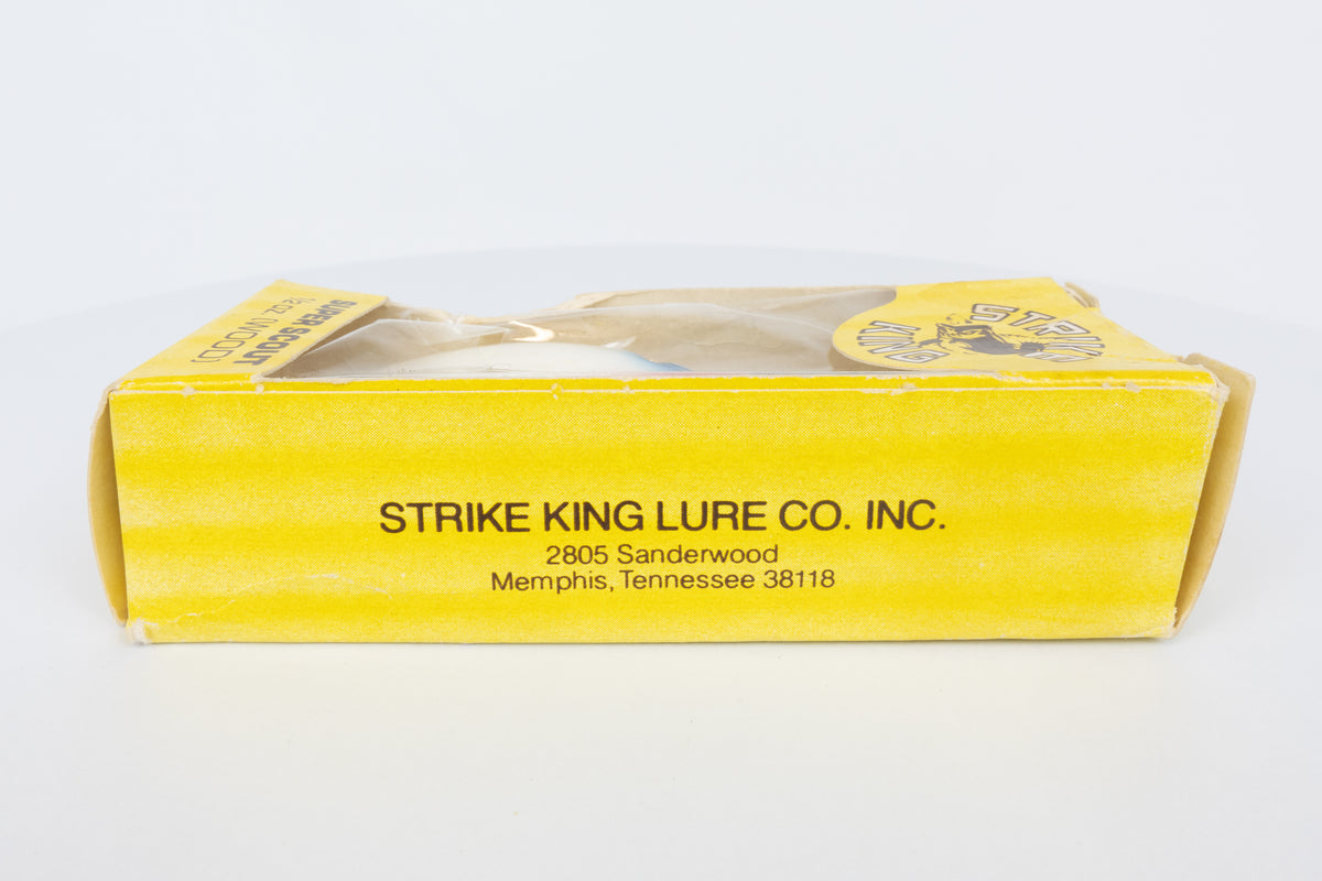 Strike King Super Scout 1/2oz. (Wood) - vintage American fishing lure, as new in original packaging (damaged), side view of lure in of packaging.