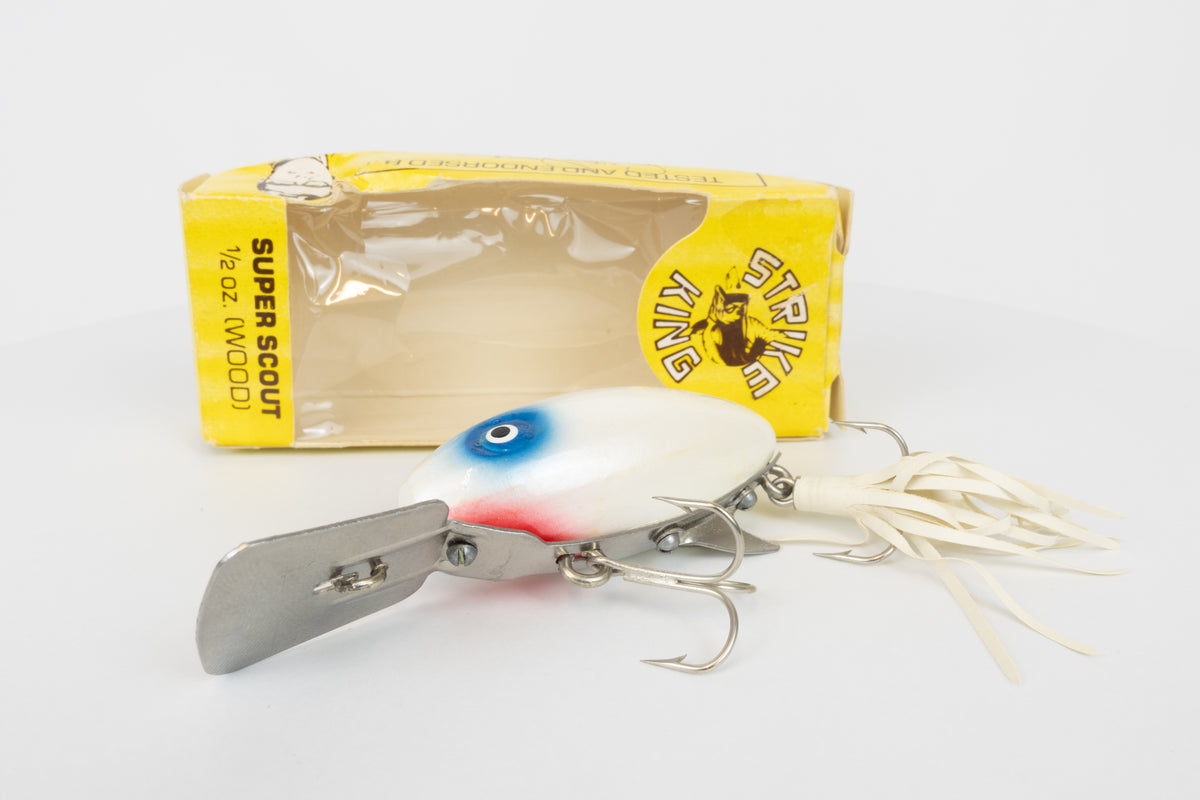 Strike King Super Scout 1/2oz. (Wood) - vintage American fishing lure, as new in original packaging (damaged), view of lure in front of packaging.