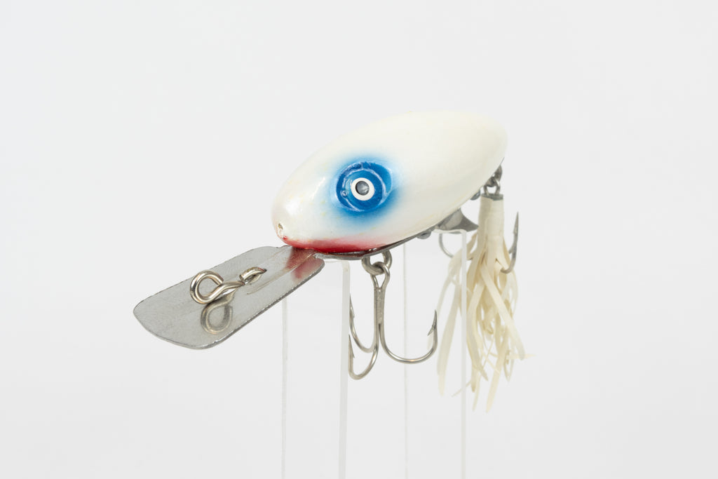 Strike King Super Scout 1/2oz. (Wood) - vintage American fishing lure, as new in original packaging (damaged), close front view of lure on stand.