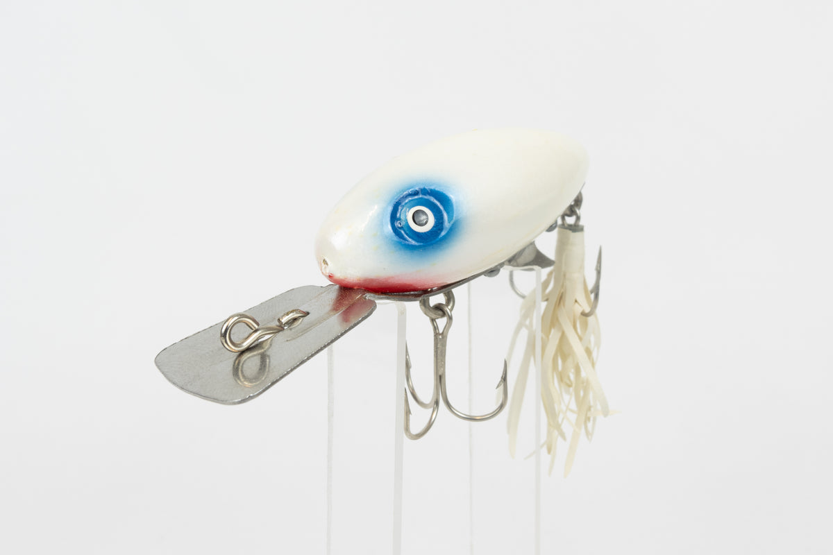 Strike King Super Scout 1/2oz. (Wood) - vintage American fishing lure, as new in original packaging (damaged), close front view of lure on stand.